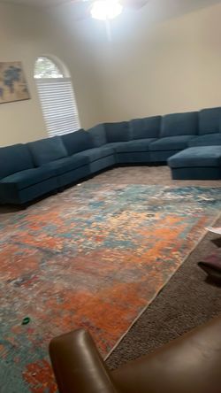 Large Teal Fabric Sectional Sofa and rug