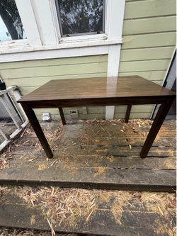 Stunning dark wood dining table