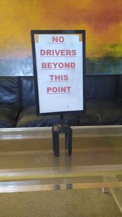 Stanchion sign holder