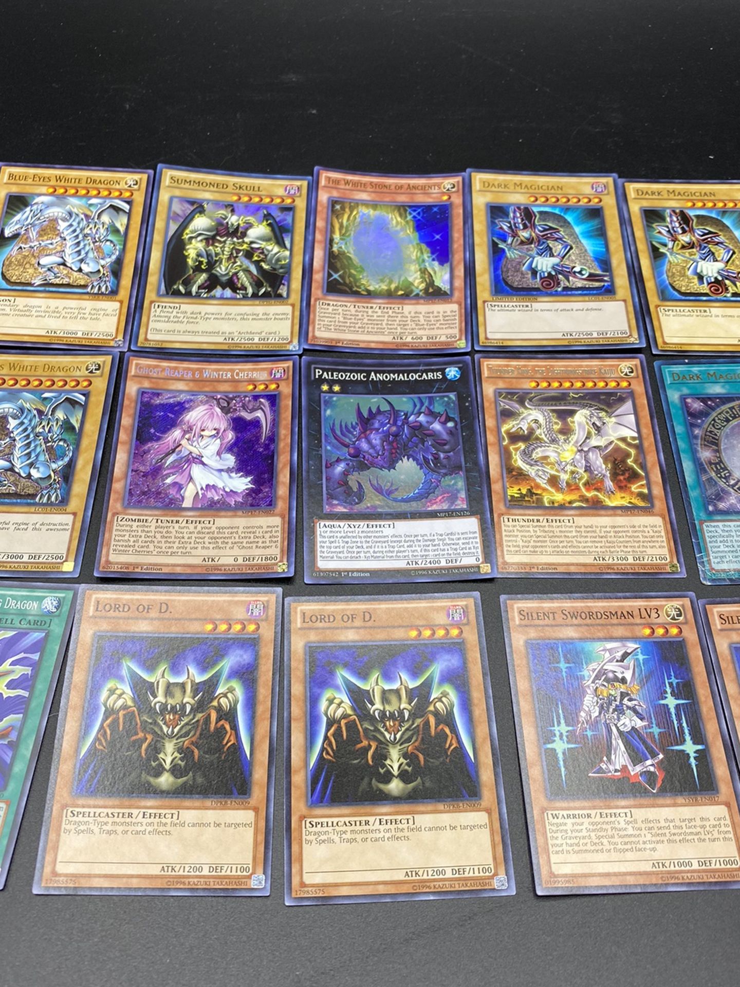 Lot 100 Yu Gi Oh Cards Blue Eyes White Dragon Dark Magician Summoned Skull W BOX PICTURES TAKEN ARE IN MY OPINION THE RARE CARDS I AM NOT A YU GI OH C