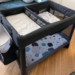 4 Moms Pack N Play,  Bassinet, Sheet, Changing Table And Diaper Storage