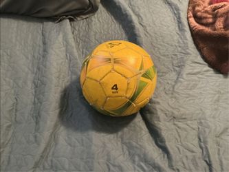 Used sized 4 soccer ball color yellow, green, orange, and gray