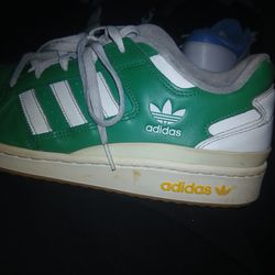 Size 11 Adidas Forum Low sneakers in a green and off-white colorway.