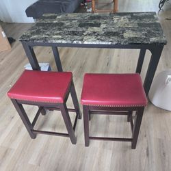 2-person marble dining table with bar stools for sale.  