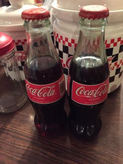 2 classic coke 1992 8 oz. bottles of unopened