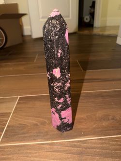pink and black Rhodonite crystal tower