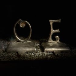 O + E Paper Weights 