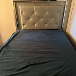 Queen size bed frame has light in backboard