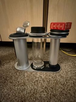 Comprehensive AeroPress glass set with display holder, metal filters, extra filters