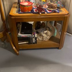 End Table With Glass And Brass Surrounding 