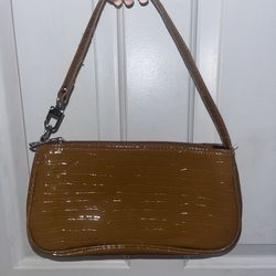 brown glossy shoulder purse