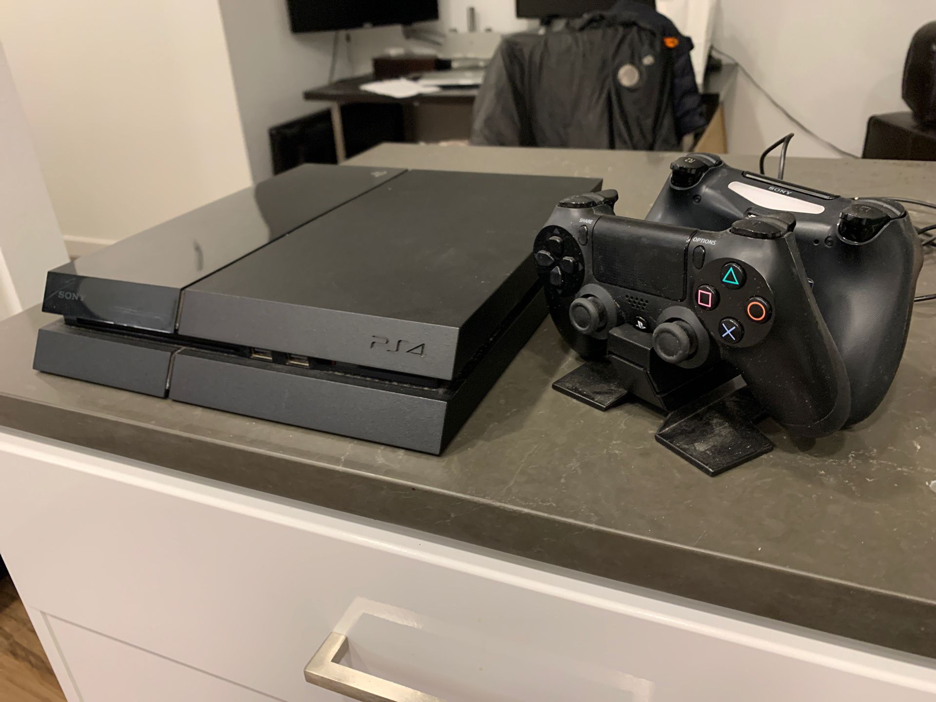 PS4 w/ 2 controllers + charging stand