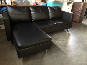 Like new black leather sectional movable chaise