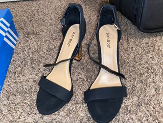 Women’s black and gold heels