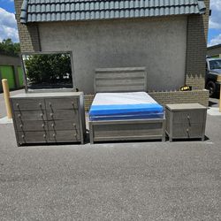 Queen size Bedroom Set with brand new Queen size plush Mattress and box spring in Plastics 