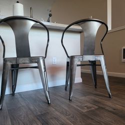 A Set Of Modern Minimalistic Metal Chairs