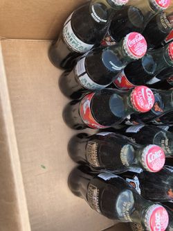 antique coke and coors bottles from the 1990's