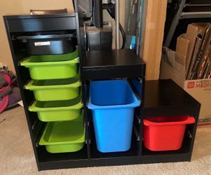 Black IKEA Trofast storage system with bins