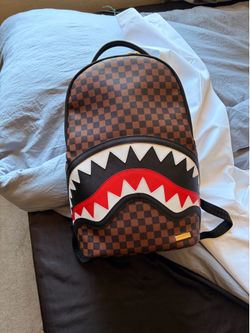 Spray ground backpack