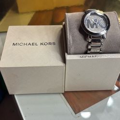 The watch in the image is a Michael Kors Runway Pavé Glitz watch, specifically the MK3375 model.