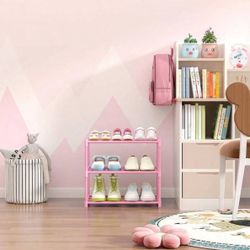 4-tier, free-standing, stackable plastic shoe rack in a bright pink color.  