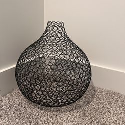 Black metal wire accent piece.