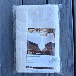 Vintage J.C. Penney new in pkg unused Terry Tablecloth 52”x90”  86% cotton 14% poly  Camel beige / off white color. Checks pattern