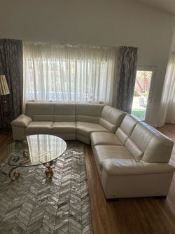 Rooms To Go sofa — glass coffee table and leather rug — in excellent condition