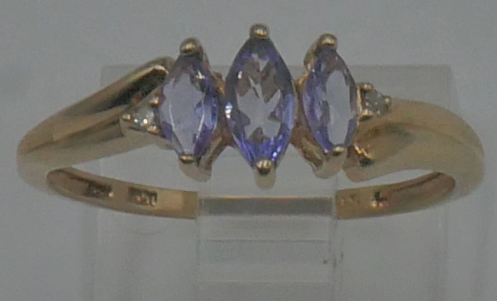 10kt yellow gold ring 1.4 grams size 7.25 2 small diamonds 3 light purple stones. 878746-3.