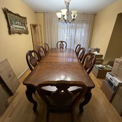 Big dinner table with 8 chairs