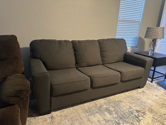 Grey couches with tv stand