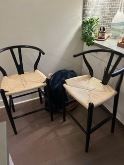 Two Counter height wishbone chair - black wood