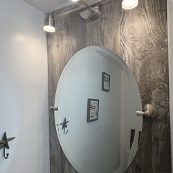Beveled tilting mirror