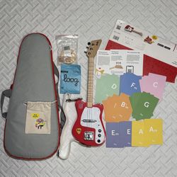 Loog Mini Electric Guitar, Gig bag, strap, 2 picks, wall hanger, extra strings, chord flashcards 