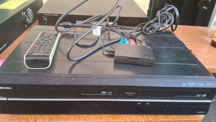 Toshiba VHS to DVD Recorder with remote control, HDMI cable, and HDMI to RCA Digital.