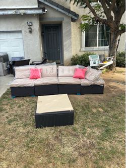 4 seater outdoor patio furniture couch with a matching glass coffee table