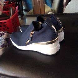 DKNY Palmas Slip On Wedge With Gold Trim And Zippers