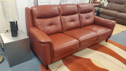 Leather power reclining sofa