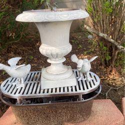 White Cast Iron Urn, 12 Inches High By 11 Inches Circumference .