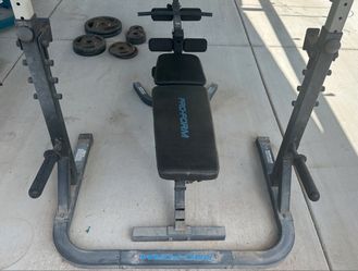 ProForm Rack & Bench Combo with CAP Barbell and cast iron weight plates.