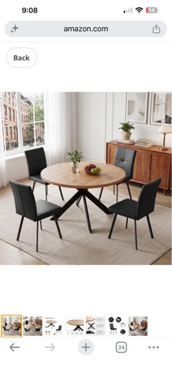 Round oak table with 4 black chairs