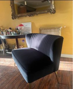 Black two seat couch with gold legs