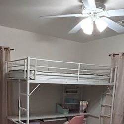 White metal loft bed with desk and storage shelves underneath, comes with mattress