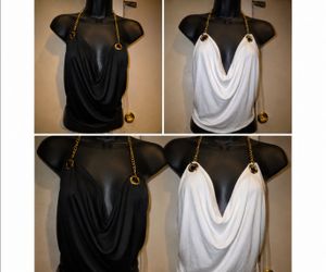black or white  draped cowl-neck top featuring striking gold-tone chain straps attached through large metal grommets