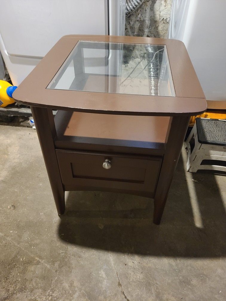 Living room side table W/ glass top Is storage underneath and a drawer