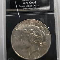 Two coins One peace dollar 1926 and Eisenhower dollar