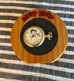 This item is a vintage Betty Boop character pocket watch, often produced as a collectible novelty item