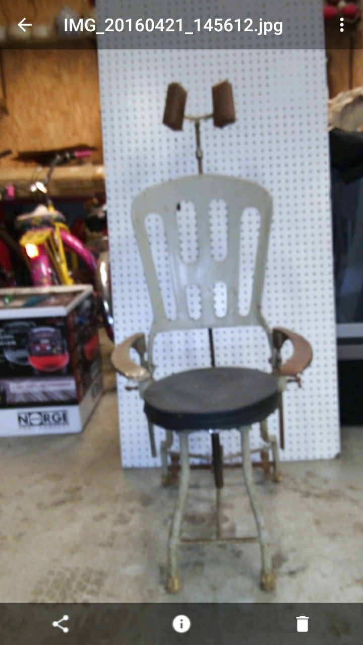 OLD DENTAL EQUIPMENT IS WitH OLD METAL CHAIR