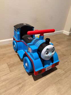 Kids’ Thomas the Train with tracks, all in working condition.