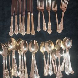 Vintage early 1970's Gold plated silverware from Kingston Jamaica 38 pieces. Beautifully intricate patterns. Comes with a Cherry Wood box with velvet 